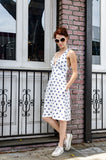 Side view of our Vintage inspired V-neck A-line shape Cotton Summer dress with pockets. Ruched bra shaped top with wide shoulder straps that cross in a back definitely call for attention. Isn't what you want this summer?