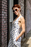 Fitted at the top and loose at the bottom this A-shape exquisite dress offers its looks and ease on a hot summer day. Adorable V-shape cut out in front and crossed in a back wide straps give this dress its own character, like no otters'. ONlLY size 4 left, is it yours?