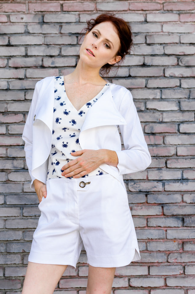 It's a perfect combo! Try our Overlapping Front Jacket in White with matching Scallop Hem Shorts paired with Boxy Top with Tie in Blue Crab! Style easy in other words! Right?