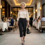 Woman in a stylish outfit walking through a restaurant.