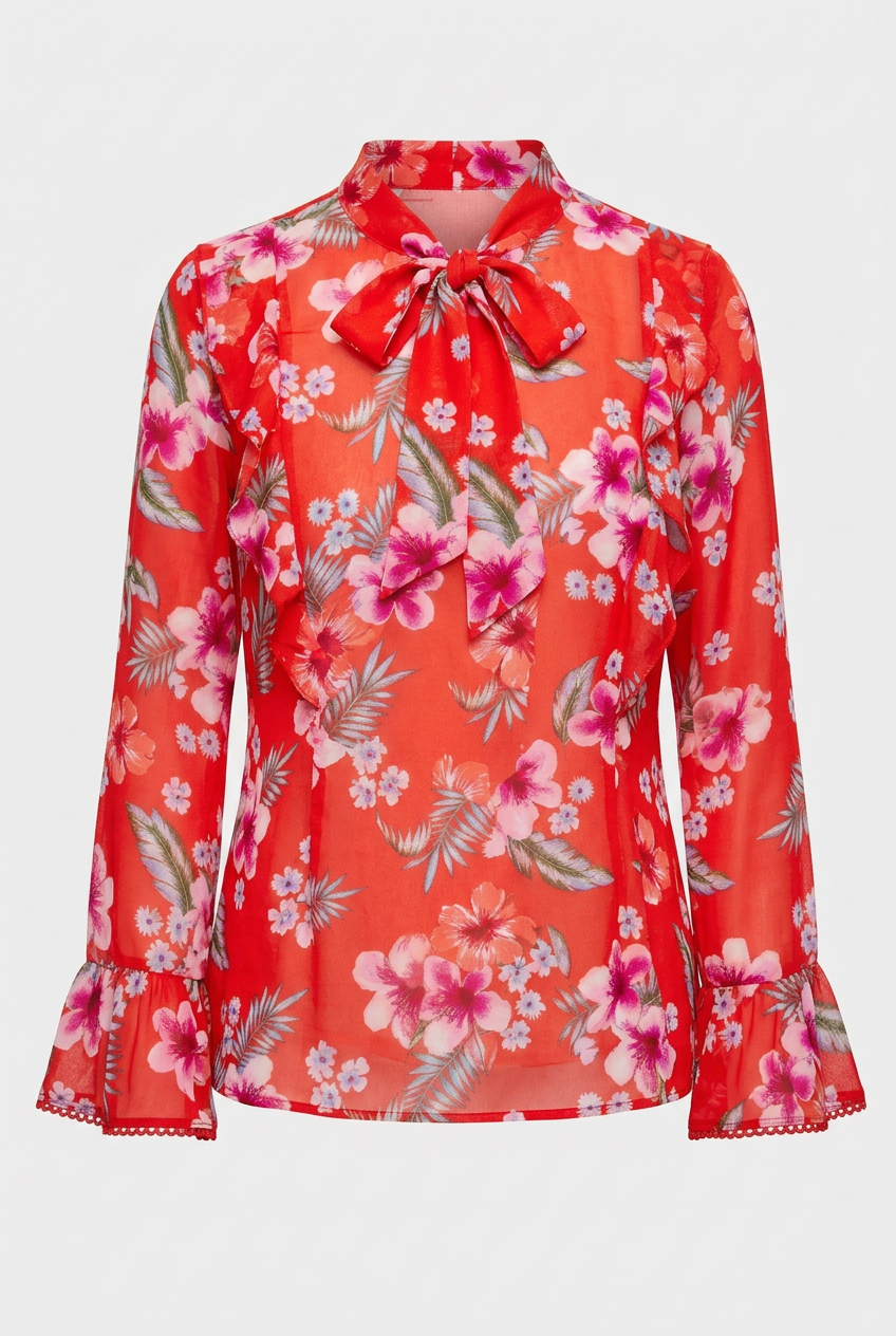 A long-sleeve red blouse with a pink and white floral print, featuring a bow tie at the collar and ruffled cuffs, shown against a light gray background.
