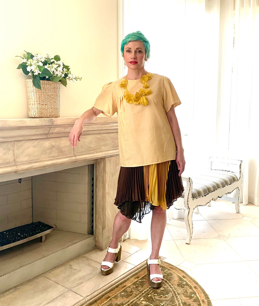 It's one of the examples how you could easily style your Riviera Top with Asymmetrical Shoulder. Layer it over a skirt and accessorize your look with a set of yellow earrings or necklace to pop these beautiful stripes' color on the fabric even more! You'd feel so comfortable, you won't even remember you are dressed up!