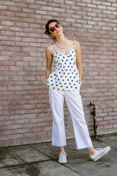 Jessie is modeling our Summer Straight Leg Boat Ankle Pants with adorable Wide Hem in White. Made out of 100% Cotton light weight Redford this pair will become your summer essential in no time. Easy Care - wear, wash, dry, repeat! No band waist yoke and front pockets are the key, and there is actually the tab to hook your keys to, as well. Going to a boat ride soon?