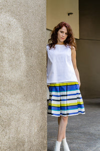 Our model, Jessie, is wearing a Box Pleat Italian Cotton Poplin Skirt with side seam pockets in Blue and Yellow Stripes combined with our A-line Cropped Top in White Pique and white ankle boots by A New Day from our designer's personal collection. Hello, summer!