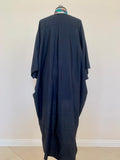 Back view of our new summer addition, Kaftan. Back yoke and center seam fold are two design elements that make this garment unique and different from any other dusters on the market. 3/4 sleeve makes it a perfect layering piece, the universal navy color is easy to pair with other pieces in your wardrobe! The fabric is not sheer and is appropriate to be worn to work. Created by a Russian designer living in Calabasas this garment has been cut and made in small batches in downtown Los Angeles.
